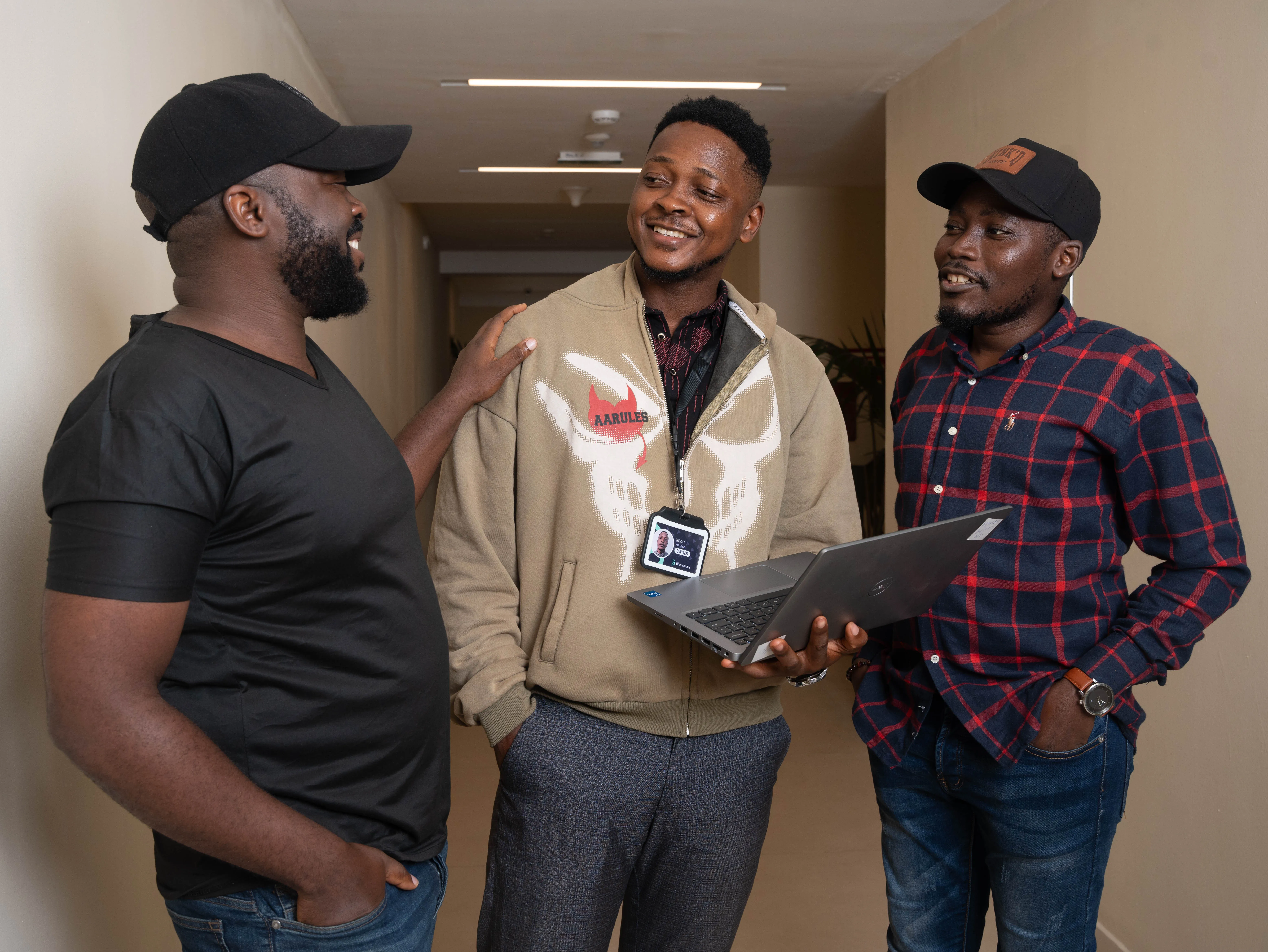 Ngoh Ronaldo Acha collaborating with senior developers Donald Kengue and Kum Jude Tem